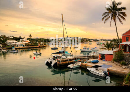 Yachts and home around Hamilton Inner Harbour at sunset in Bermuda Stock Photo