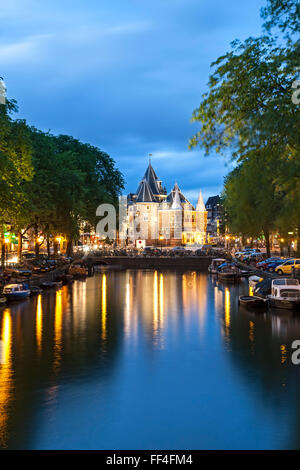 De Waag (Weigh House), now a restaurant, and canal, Amsterdam, Holland, the Netherlands Stock Photo