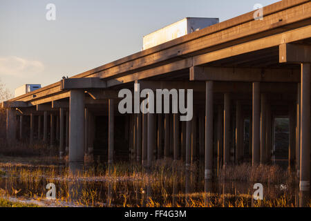 trucks on an elevated country highway California Stock Photo