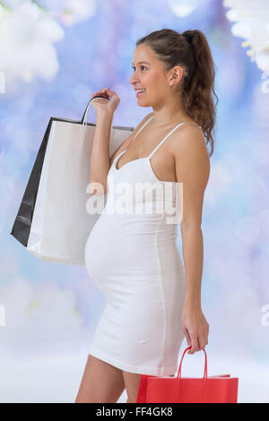 portrait of an Asian Pregnant woman holding paper bag, Stock Photo