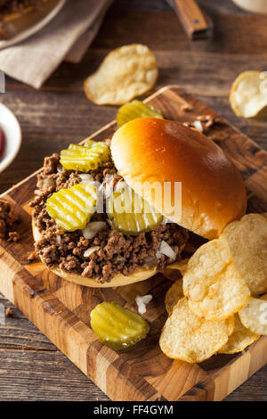 Homemade Loose Meat Tavern Sandwich with Onion and Pickle Stock Photo