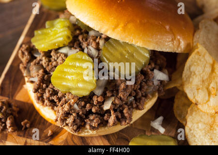 Homemade Loose Meat Tavern Sandwich with Onion and Pickle Stock Photo