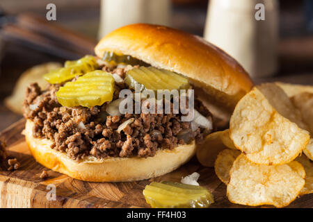 Homemade Loose Meat Tavern Sandwich with Onion and Pickle Stock Photo