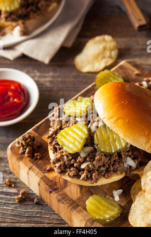 Homemade Loose Meat Tavern Sandwich with Onion and Pickle Stock Photo