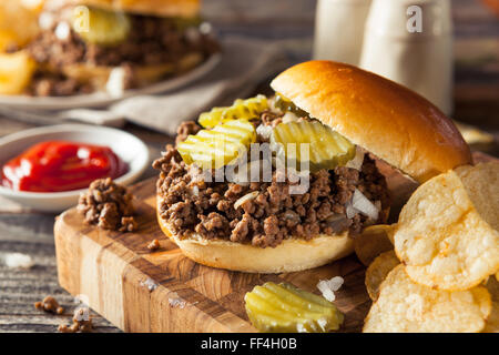 Homemade Loose Meat Tavern Sandwich with Onion and Pickle Stock Photo