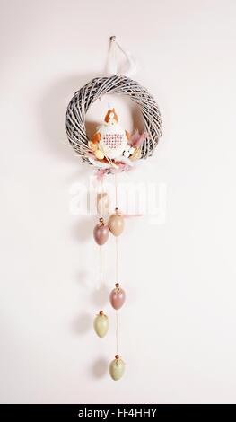 Easter floral home decoration hangs on the wall. Homemade arrangement. Stock Photo
