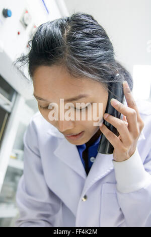 woman with phone calls in the laboratory Stock Photo - Alamy