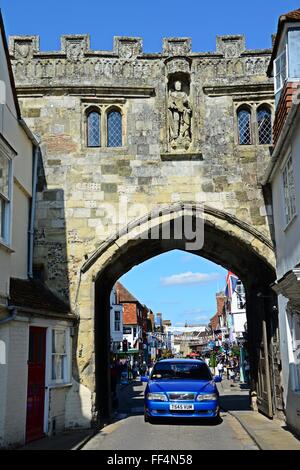 Cars and people near North Gate in the summer sunshine, in the High Street, Salisbury  United Kingdom. Portrait format image. Stock Photo