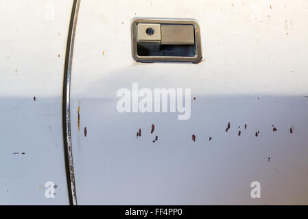 Door handle on an old white classic car Stock Photo