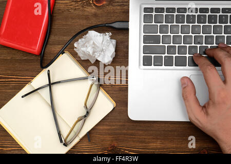 Workplace, Man working on the laptop. top view Stock Photo