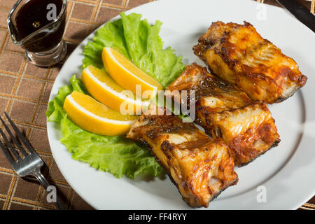fried catfish. delicious fatty fish on a plate Stock Photo