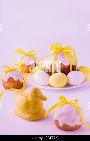 Decorated easter cakes and eggs  in yellow colors. Selective focus. Stock Photo