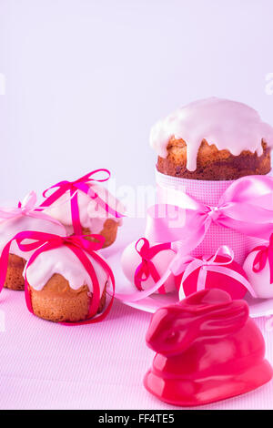 Decorated easter cakes and eggs  in pink pastel colours. Selective focus. Stock Photo