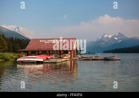 Afternoon sunlight at Jasper National Park's Maligne Lake and Curly Phillips historic Boat House in Canadian Rocky Mountains. Stock Photo