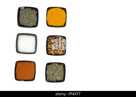 Different bowls of spices on white background Stock Photo