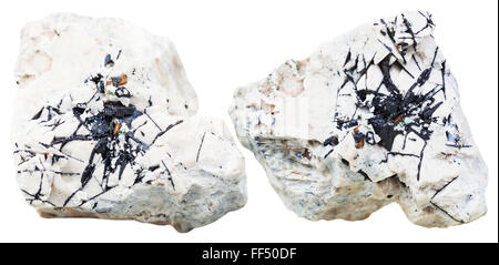macro shooting of natural mineral stone - two pieces of dolomite rock with Ilmenite crystals isolated on white background Stock Photo
