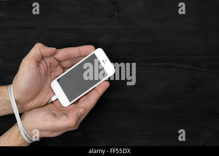 Male hands and smartphone. Addiction to internet and social networks Stock Photo