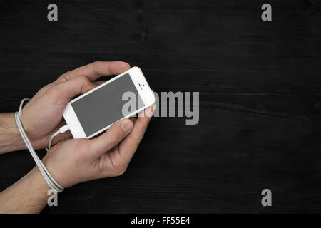 Male hands and smartphone. Addiction to internet and social networks Stock Photo