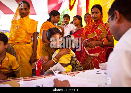 Families from the Dobhanda Nagar slum in Cuttack get legal advice and birth certificates from the Urban Law centre run by the organisation CLAP, Committee for Legal Aid to Poor, helps provide legal aid to the poorer communities in the Orissa district of India. Stock Photo