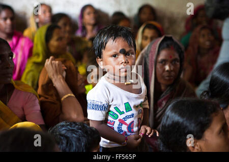 Families from Cuttack get legal advice and birth certificates from a Legal Aid Clinic run by the organisation CLAP. Committee for Legal Aid to Poor (CLAP), helps provide legal aid to the poorer communities in the Orissa district of India. Stock Photo