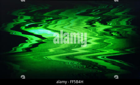 Green interlaced tv screen static noise, vignette abstraction background backdrop Stock Photo