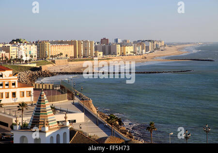 Coastal view east of sandy beaches and apartment housing, Cadiz, Spain Stock Photo