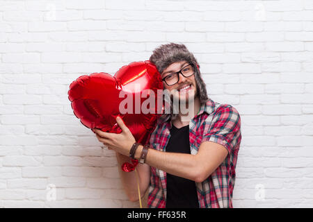 Man Hug Red Heart Shape Baloon Hipster Fashion Style Wearing Hat Glasses Stock Photo