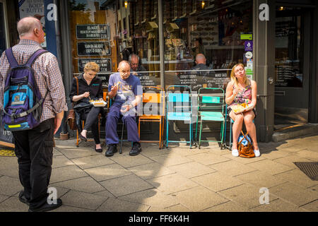 People outside of fish and chips shop, Norwich, Norfolk, UK Stock Photo