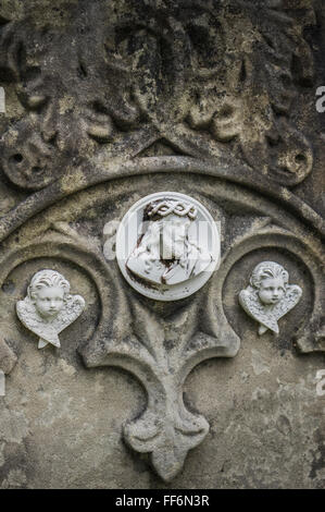 jesus with crown of thorns and two angels, tombstone relief Stock Photo