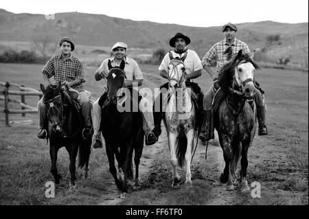 Gauchos ride through the Sierras Chicas in the Cordoba countryside, Argentina Stock Photo