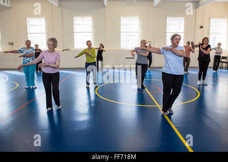 Local elderly members of the community take part in an exercise class at the Percy centre, Bath Somerset. Stock Photo