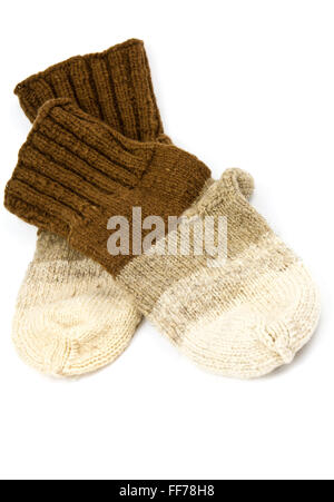 Traditional hand-knit wool socks in three colors Stock Photo