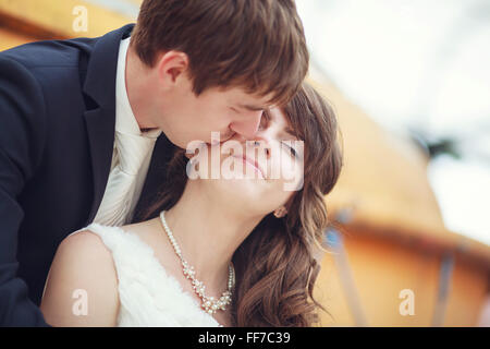 The groom kisses his bride on their wedding day Stock Photo