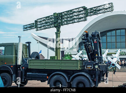 5th Belarusian military exhibition MILEX 2009 - may 2009.Truck with the manipulator of loading of freight.Rockets and radar. Stock Photo