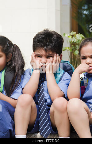 Asia Asian Asians Backpacks Chin on Hand Chin on Hands Classmates Close Up Closeup Close-Up Clothes Colors Image Colour Image Stock Photo