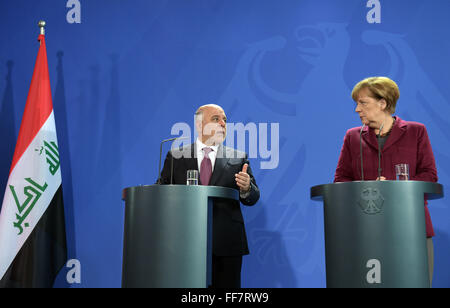 Berlin, Germany. 11th Feb, 2016. German Chancellor Angela Merkel (CDU) and Iraqi Prime Minister Haider al-Abadi (L) speak during a press conference at the chancellery in Berlin, Germany, 11 February 2016. Photo: Rainer Jensen/dpa/Alamy Live News Stock Photo