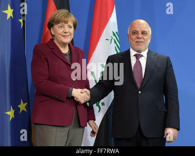 Berlin, Germany. 11th Feb, 2016. German Chancellor Angela Merkel (CDU) and Iraqi Prime Minister Haider al-Abadi (R) shake ahnds after press conference at the chancellery in Berlin, Germany, 11 February 2016. Photo: Rainer Jensen/dpa/Alamy Live News Stock Photo