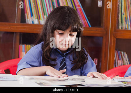 Asia Asian Asians Book Shelves Classroom Scene Classroom Scenes Examinations Female Females Head and Shoulders Higher Education Stock Photo