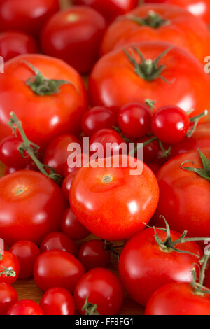 Delicious fresh red tomatoes of different colours Stock Photo