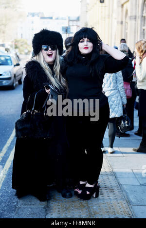 Brighton, UK. 11th February, 2016. This couple of fashionable ladies are dressed to stay warm as the weather turns colder in Brighton today as they attended the University of Brighton Graduation Ceremony held in The Dome . The forecast is for colder weather to spread across Britain with snow predicted for next week  Credit:  Simon Dack/Ģ����ý Live News Stock Photo