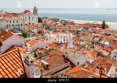 Portugal, Lisbon, view from Miradouro das Portas do Sol of the Tagus River and the roofs of the Lisbon neighbourhood of Alfalma Stock Photo