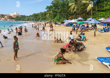 Local people at Sosua beach , kids,  Sosua, , Puaerto Plata,  Dominican Republic