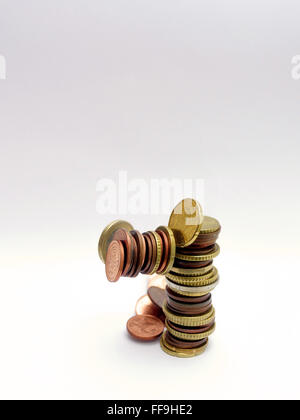 pile of Euro coins falling or collapsing Stock Photo