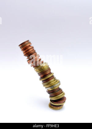 pile of Euro coins falling or collapsing Stock Photo