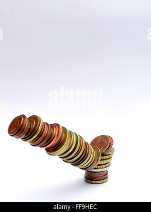 pile of Euro coins falling or collapsing Stock Photo