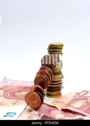 pile of Euro coins falling or collapsing Stock Photo