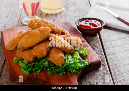 chicken wings fried in breadcrumbs with sauce Stock Photo