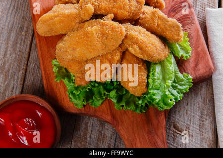 chicken wings fried in breadcrumbs with sauce Stock Photo