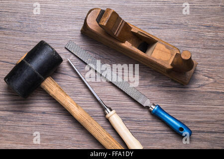 Image shows different carpenter tools on wooden table Stock Photo