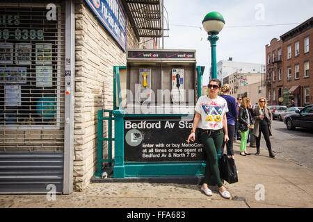 NEW YORK CITY - APRIL 28, 2013: Street corner scene from Williamsburg Brooklyn, New York City with Bedford Avenue subway entranc Stock Photo